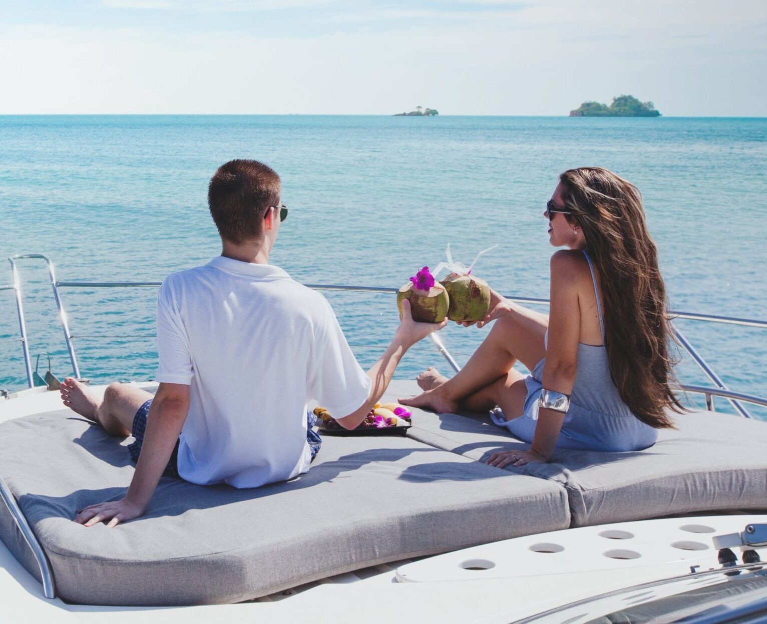 Photo of two people on a luxury charter enjoying one of the top things to do in Murrells Inlet