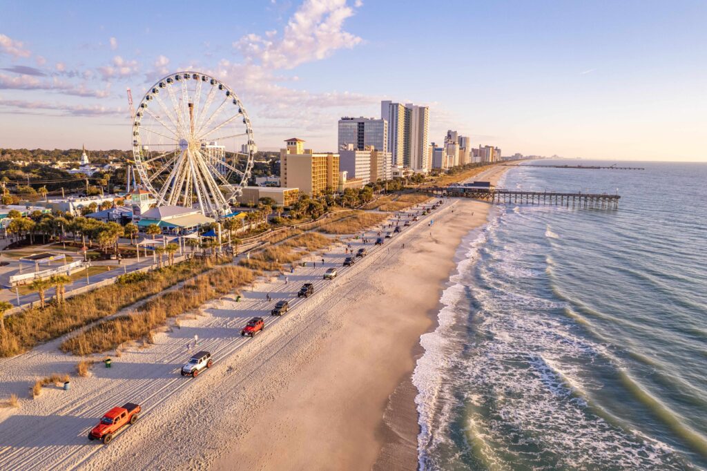 View of Myrtle Beach shoreline, water, and ferris wheel